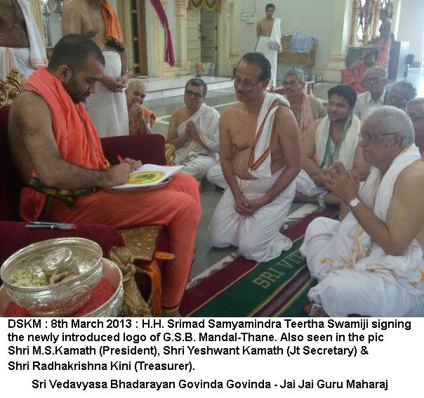 Swamiji Signing GSB Logo